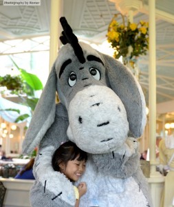 Hugging Eeyore "good-bye" at the Crystal Palace Restaurant in Magic Kingdom.
