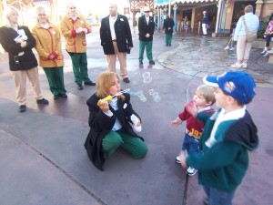 Magic Kingdom cast members entertaining dining guests before park opening.