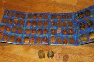 Some of our pressed pennies in a souvenir holder you can purchase at WDW