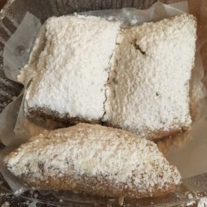 Donut like treats called Beignets can be made Allergy-friendly, powdered sugar coated donut-like sweets