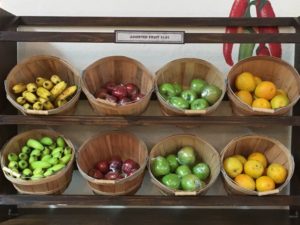Fresh Fruit in Baskets. Bananas, red apples, grreen apples, oranges